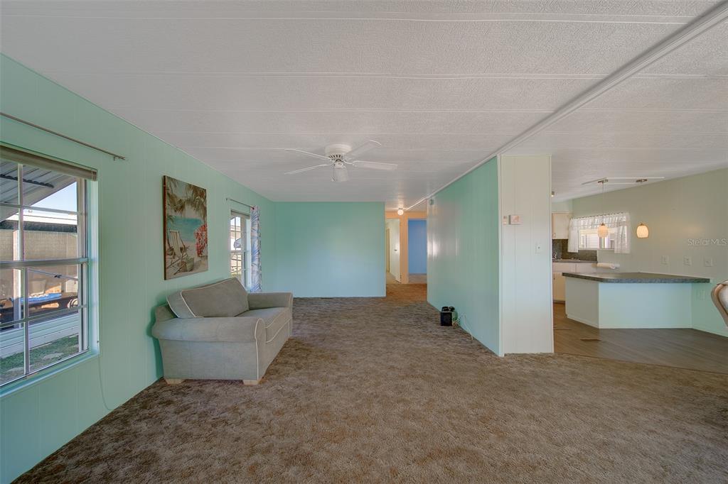12501 Ulmerton Road, Unit 128 Largo, FL 33774 - Photo 15 of 71 a view of a livingroom with furniture and an entryway