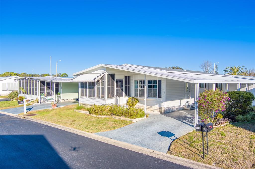 12501 Ulmerton Road, Unit 128 Largo, FL 33774 - Photo 2 of 71 a view of a house with swimming pool