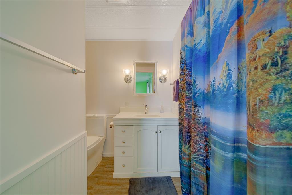 12501 Ulmerton Road, Unit 128 Largo, FL 33774 - Photo 27 of 71 a bathroom with a sink and a mirror
