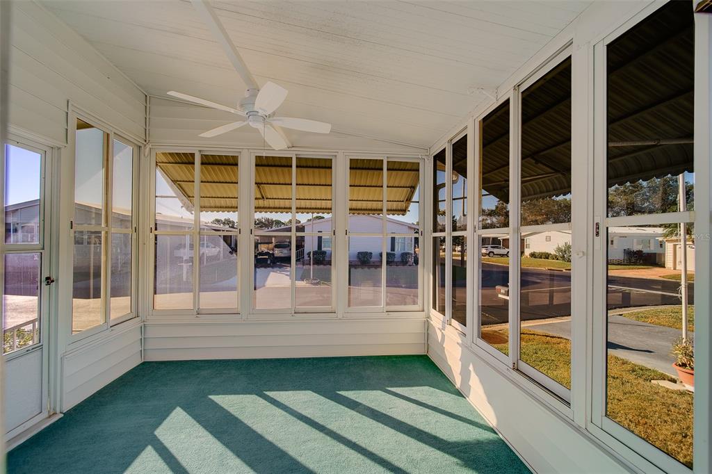 12501 Ulmerton Road, Unit 128 Largo, FL 33774 - Photo 35 of 71 a view of a porch with a table and chairs