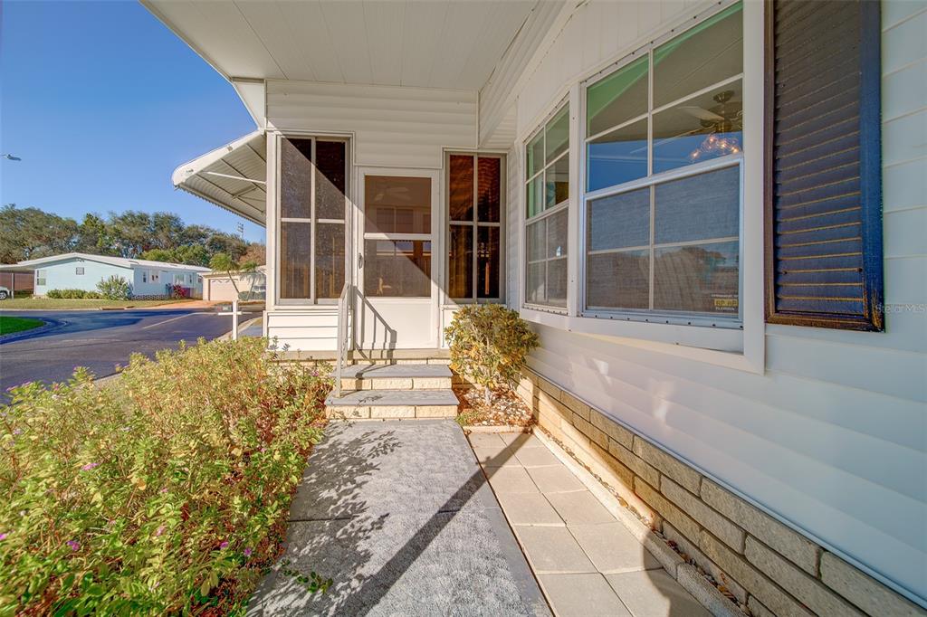 12501 Ulmerton Road, Unit 128 Largo, FL 33774 - Photo 42 of 71 a view of a house with a large window and wooden floor