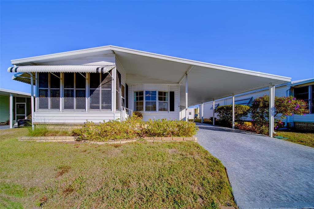 12501 Ulmerton Road, Unit 128 Largo, FL 33774 - Photo 46 of 71 front view of a house with a patio