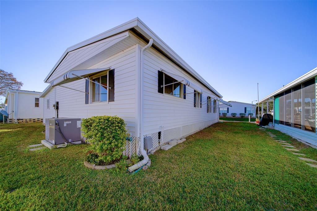 12501 Ulmerton Road, Unit 128 Largo, FL 33774 - Photo 49 of 71 a view of backyard with a garden and plants