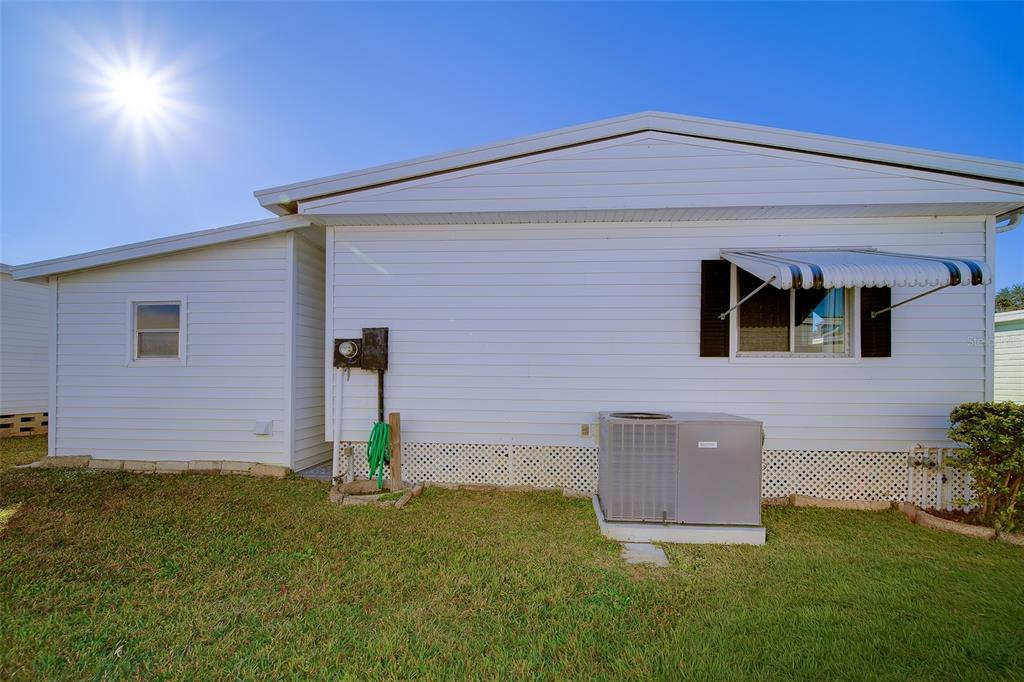 12501 Ulmerton Road, Unit 128 Largo, FL 33774 - Photo 50 of 71 a backyard of a house with table and chairs