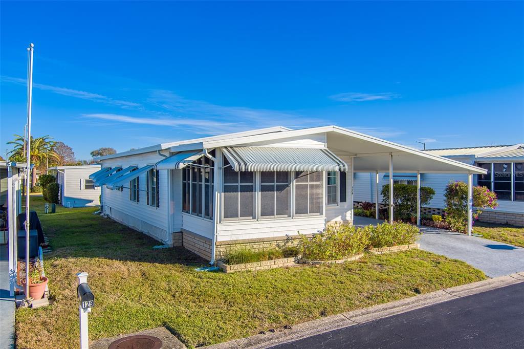 12501 Ulmerton Road, Unit 128 Largo, FL 33774 - Photo 54 of 71 a view of a house with backyard porch and sitting area