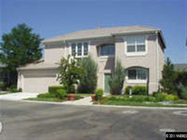 1173 Tule Drive Reno, NV 89521 - Photo 1 of 1 a front view of a house with a yard and a garage