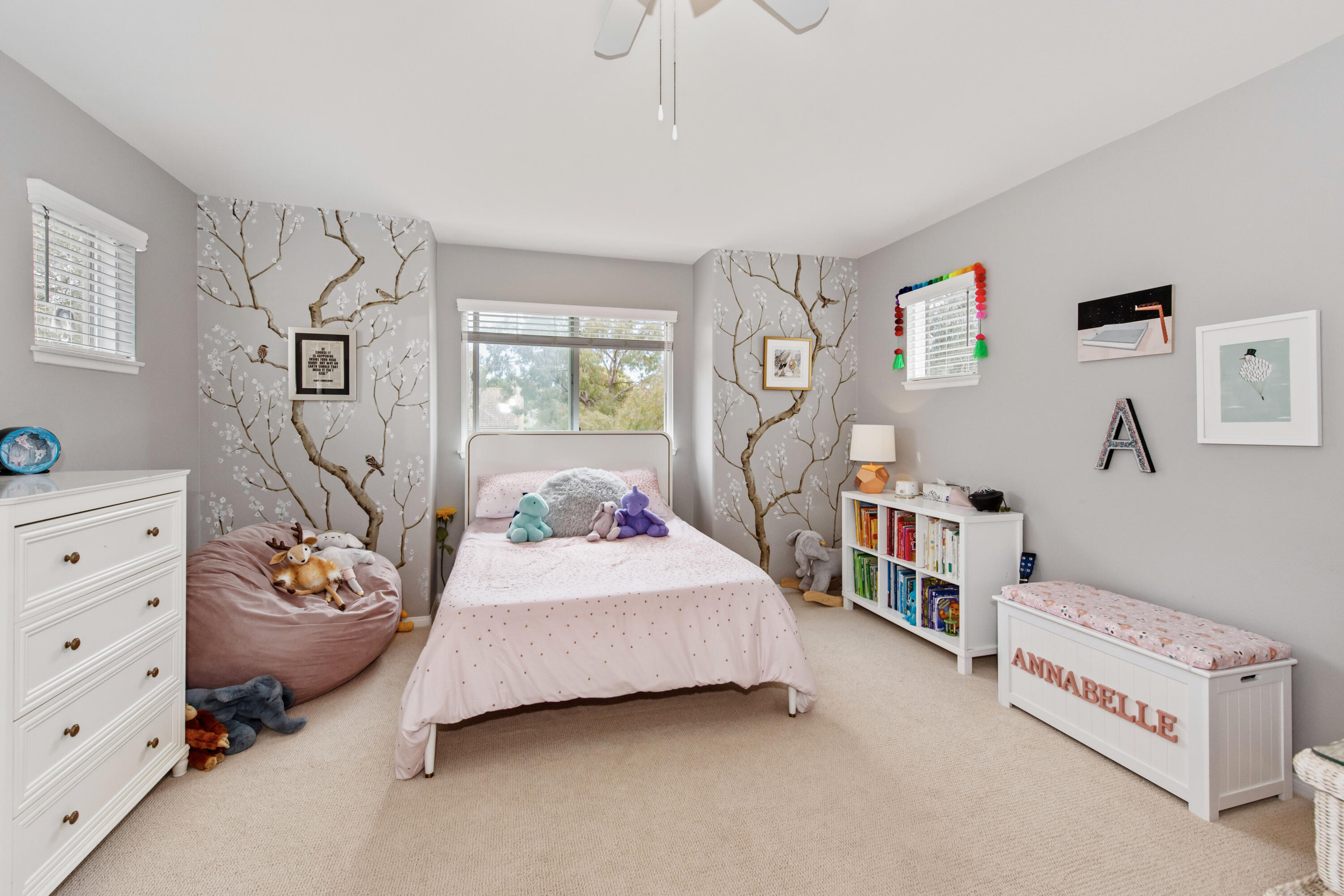 7906 Winchester Circle Goleta, CA 93117 - Photo 15 of 26 a bedroom with furniture and a book shelf