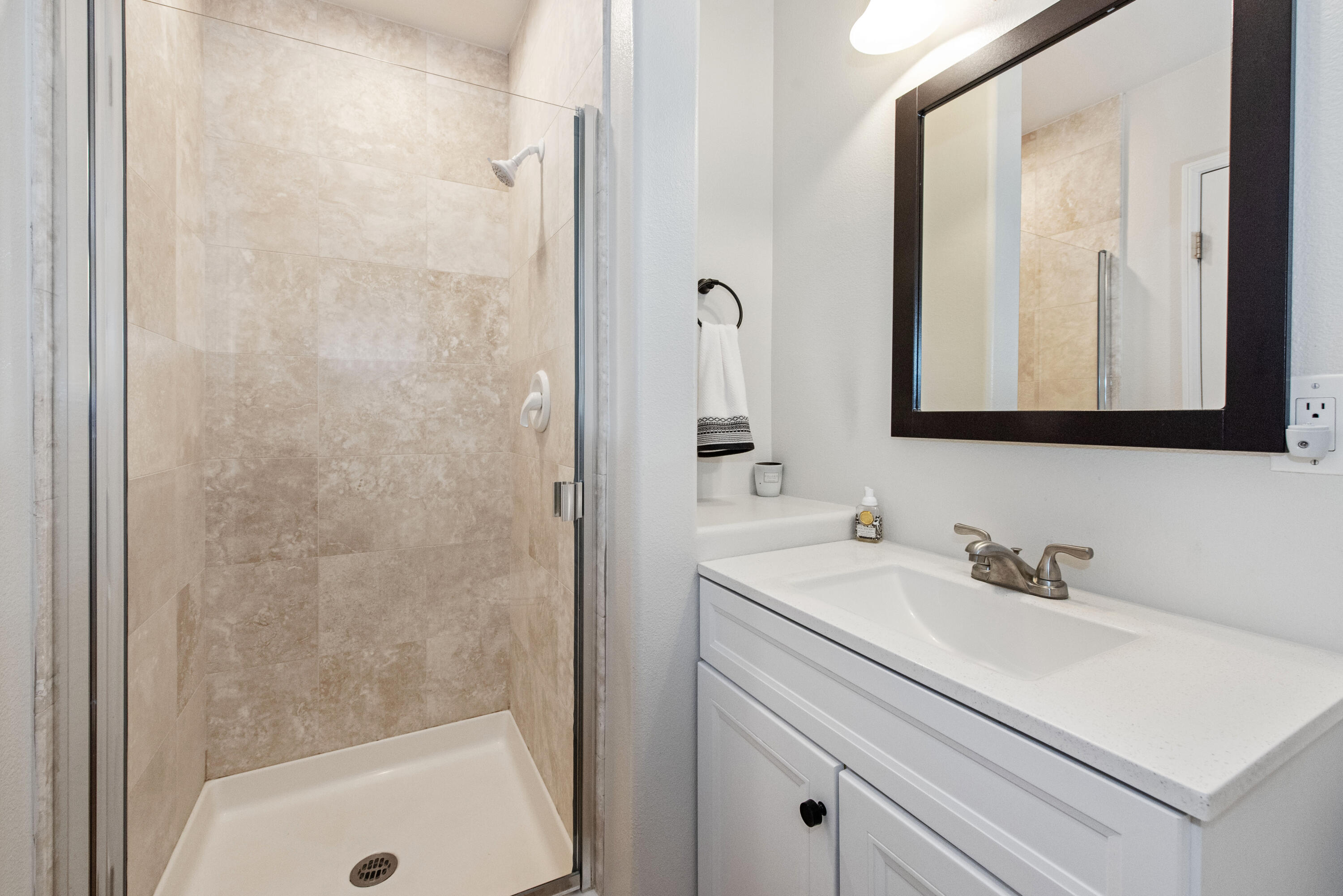 7906 Winchester Circle Goleta, CA 93117 - Photo 18 of 26 a bathroom with a sink a mirror and a bathtub