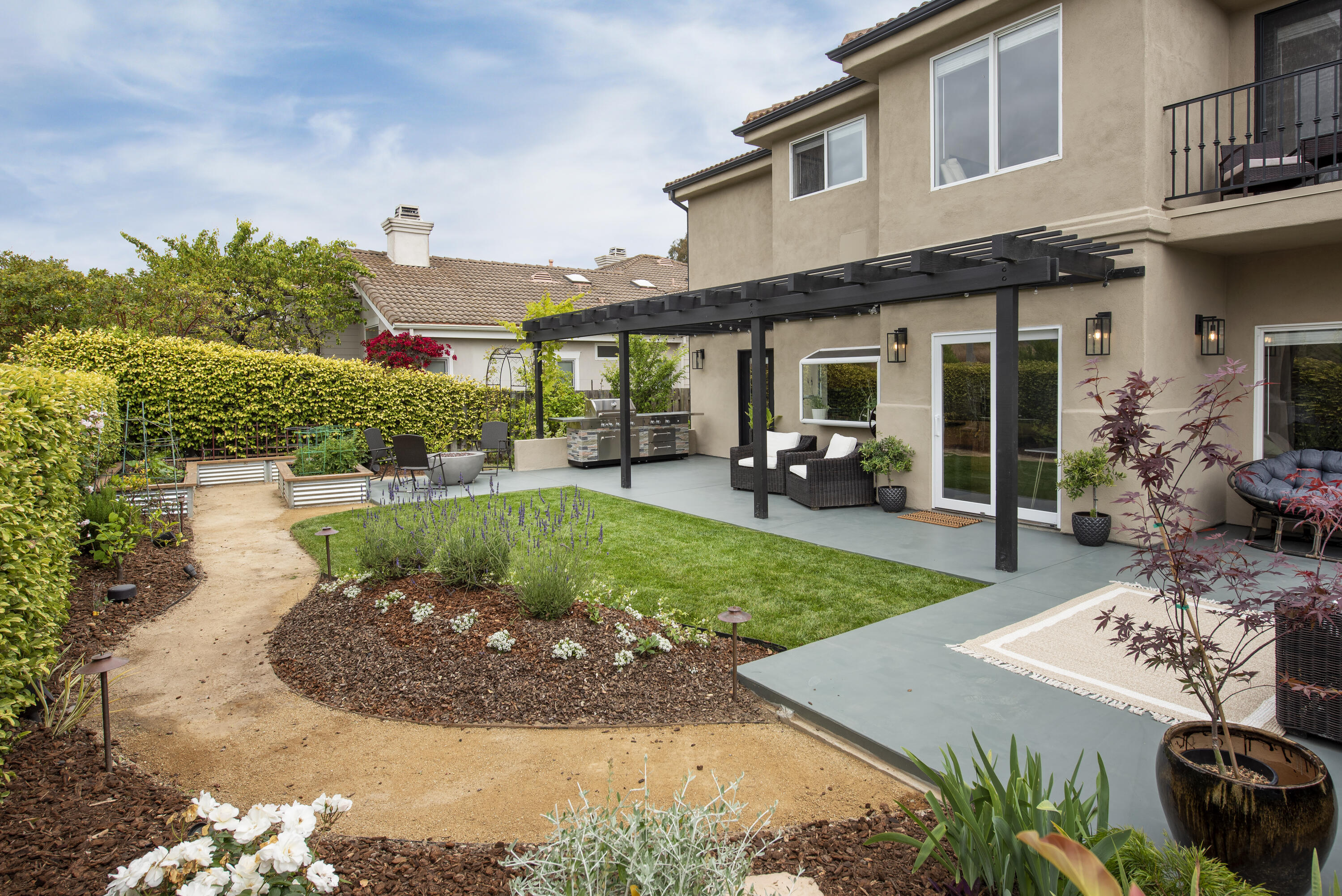 7906 Winchester Circle Goleta, CA 93117 - Photo 19 of 26 a view of a house with backyard and sitting area