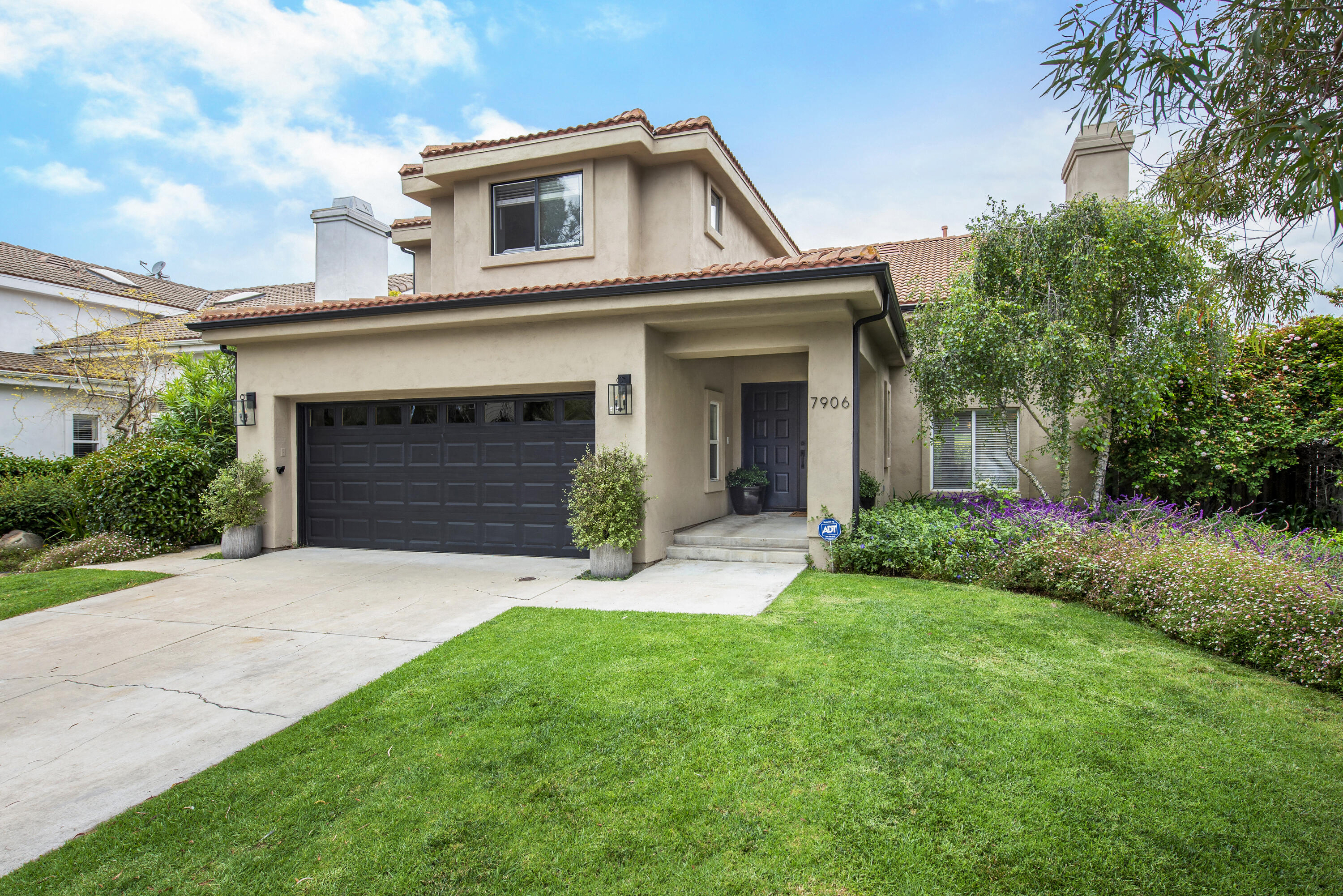 7906 Winchester Circle Goleta, CA 93117 - Photo 2 of 26 a front view of a house with a garden and plants