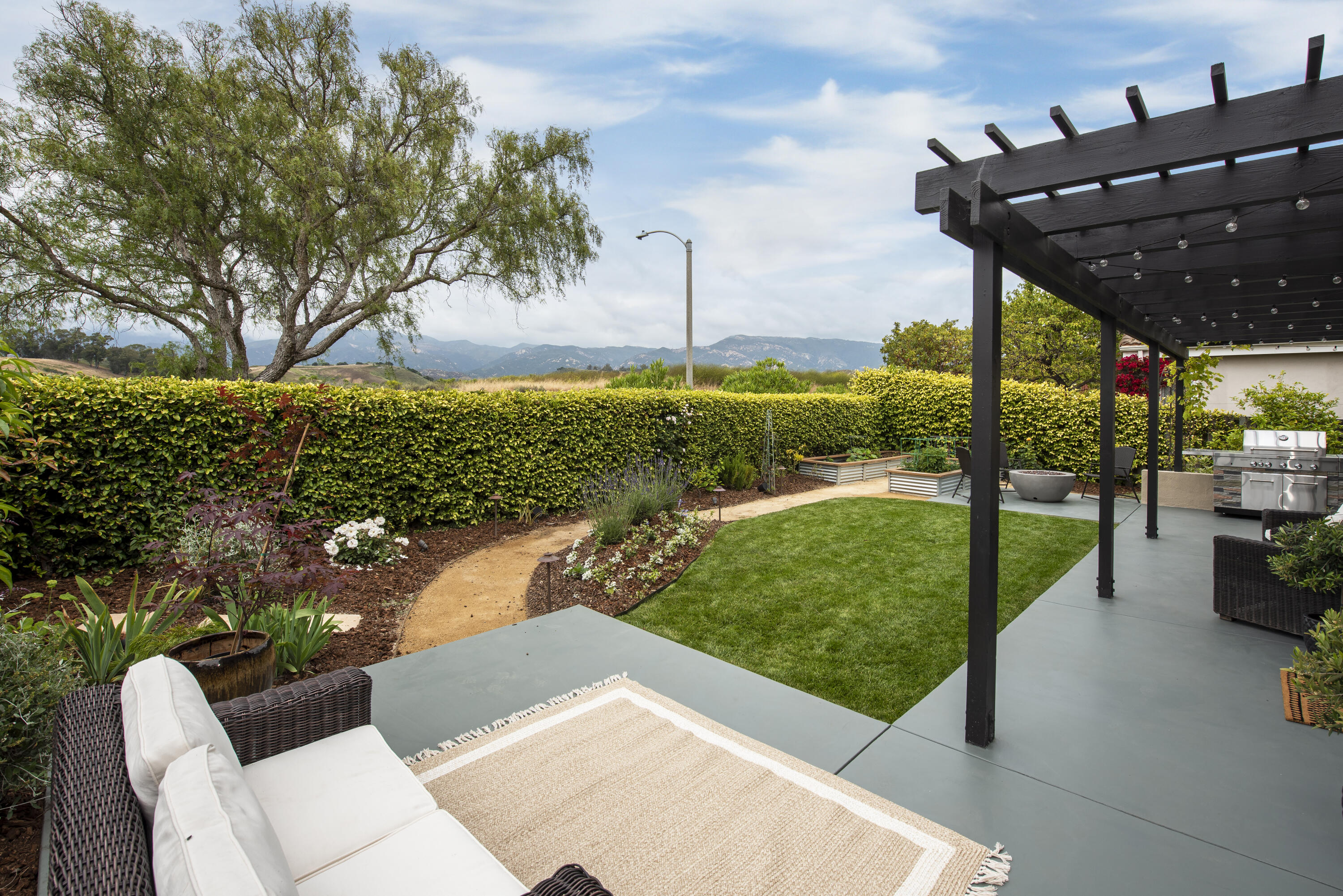 7906 Winchester Circle Goleta, CA 93117 - Photo 21 of 26 a view of a porch with furniture and a yard