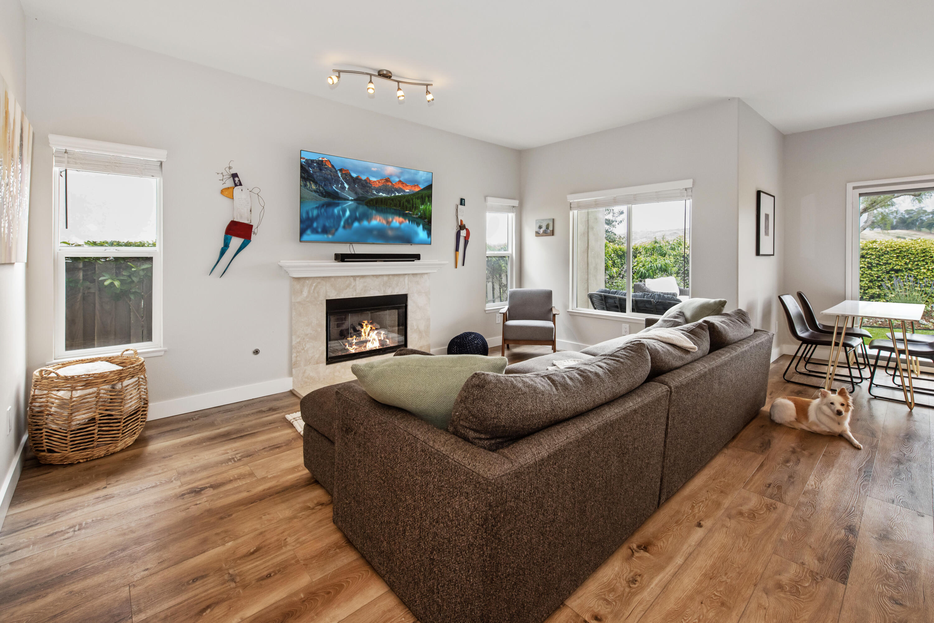 7906 Winchester Circle Goleta, CA 93117 - Photo 9 of 26 a living room with furniture a flat screen tv and a fireplace