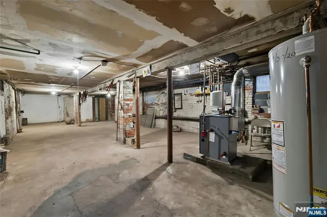 a view of empty room with wooden walls