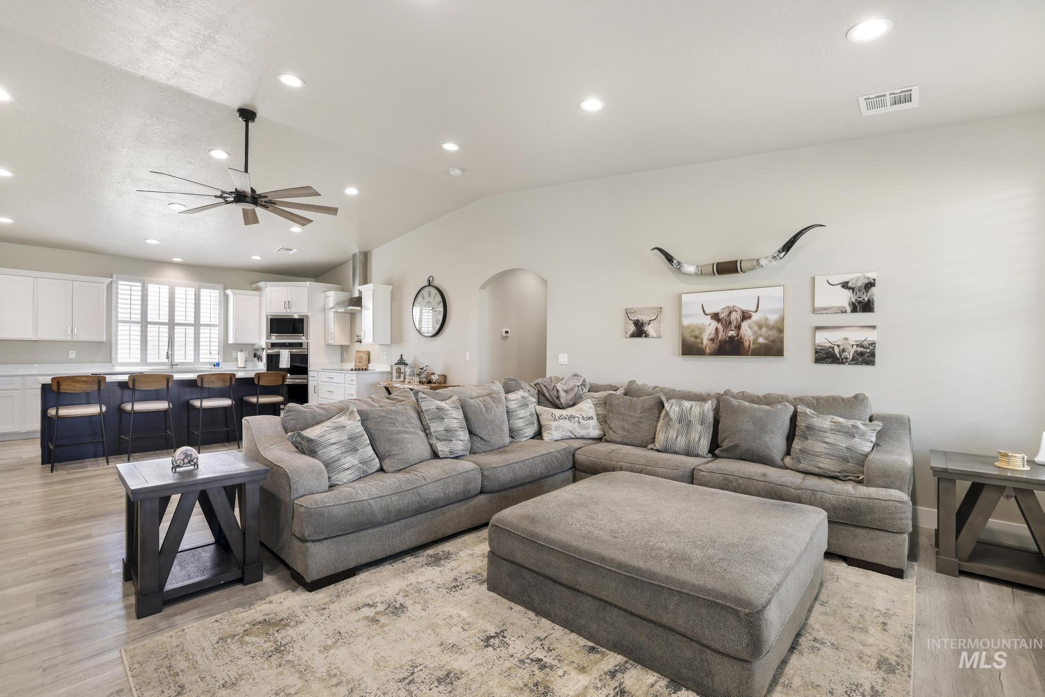 758 Cedar Crk Road Rogerson, ID 83302 - Photo 3 of 50 Open-concept living area featuring wood-finish flooring, recessed lighting, and a contemporary ceiling fan