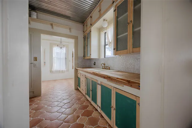 a kitchen with stainless steel appliances granite countertop a sink and cabinets