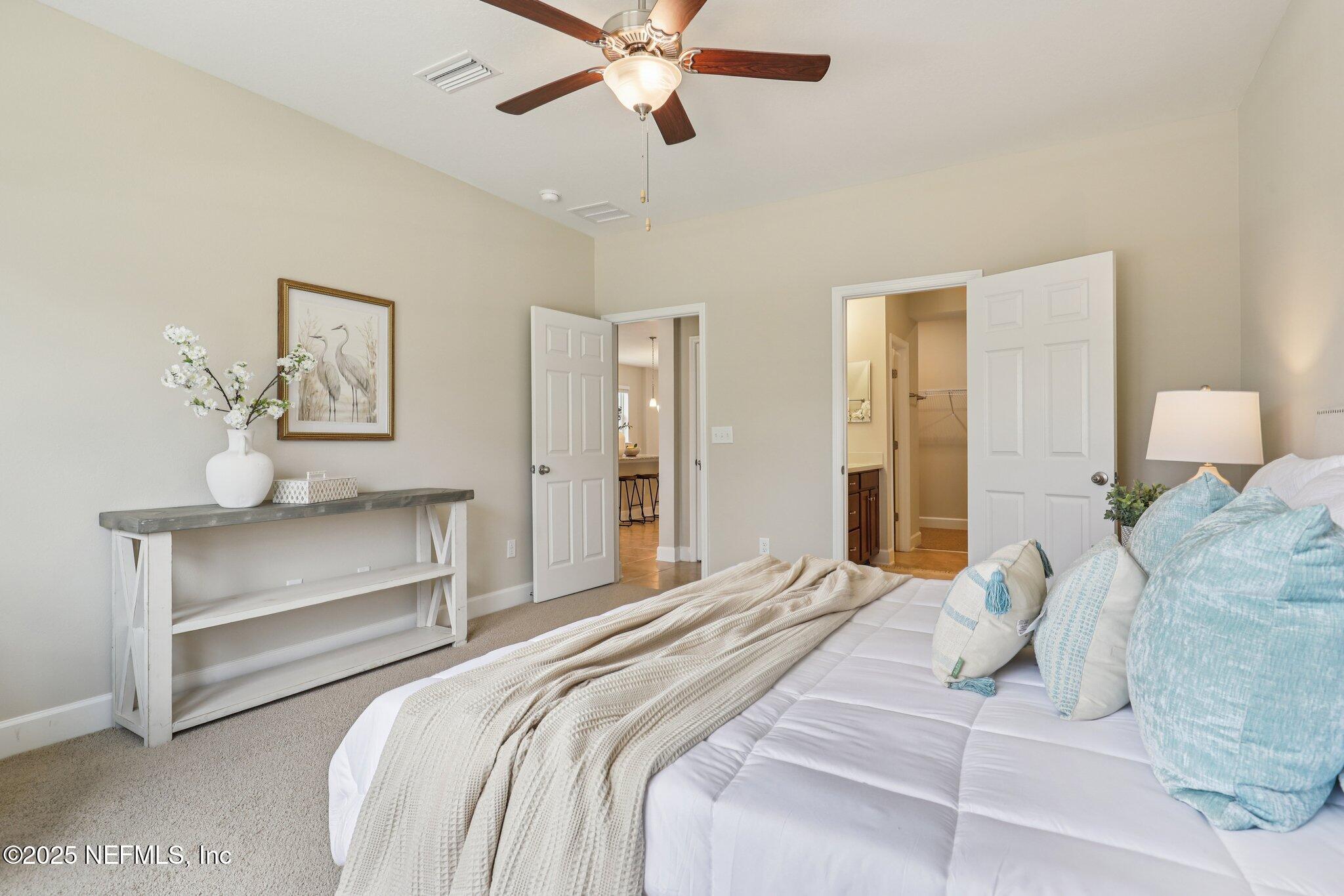 48 Gilchrist Way St. Augustine, FL 32092 - Photo 21 of 50 a bedroom with a bed and ceiling fan