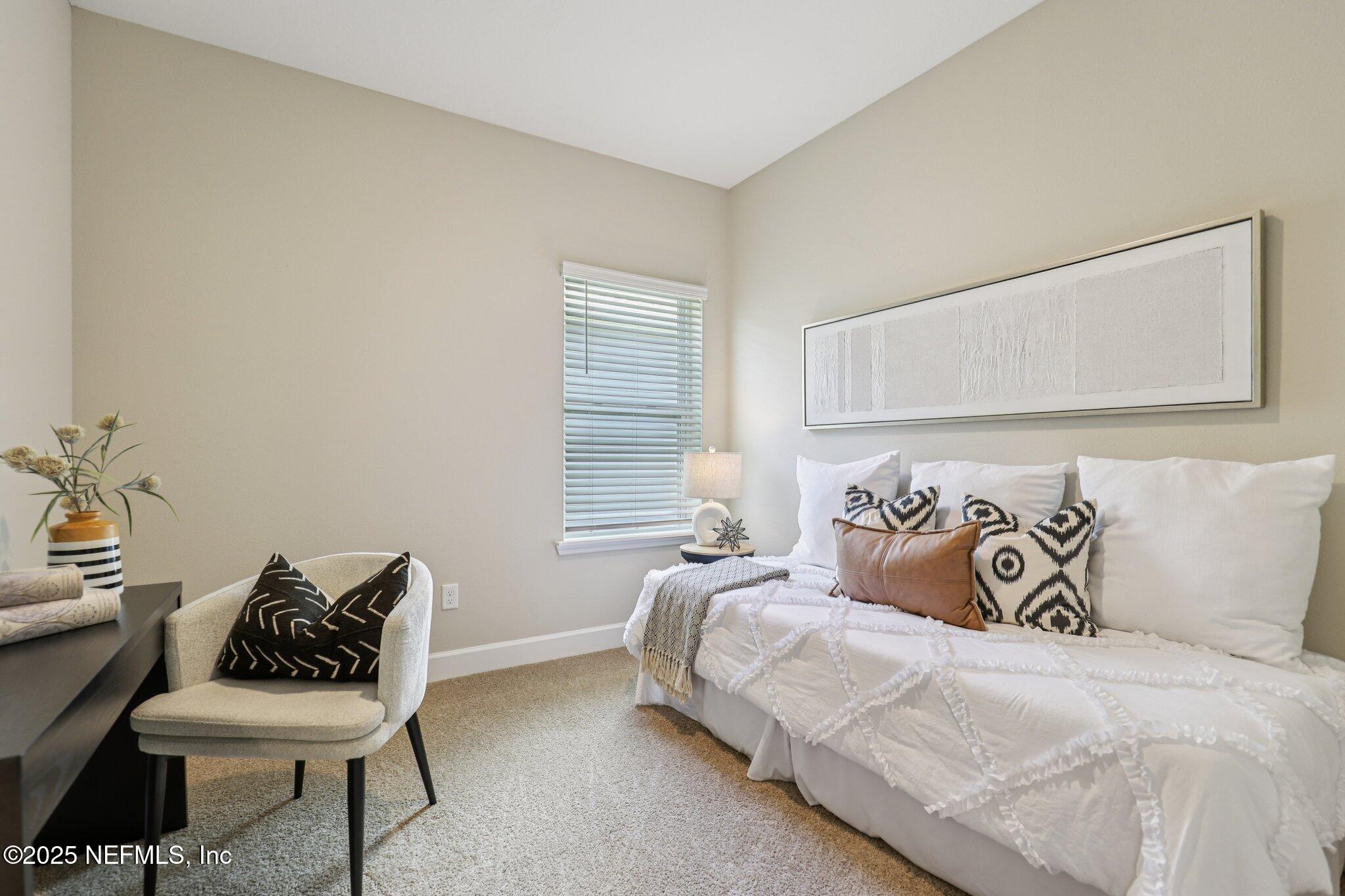 48 Gilchrist Way St. Augustine, FL 32092 - Photo 28 of 50 a bedroom with a bed and a couch