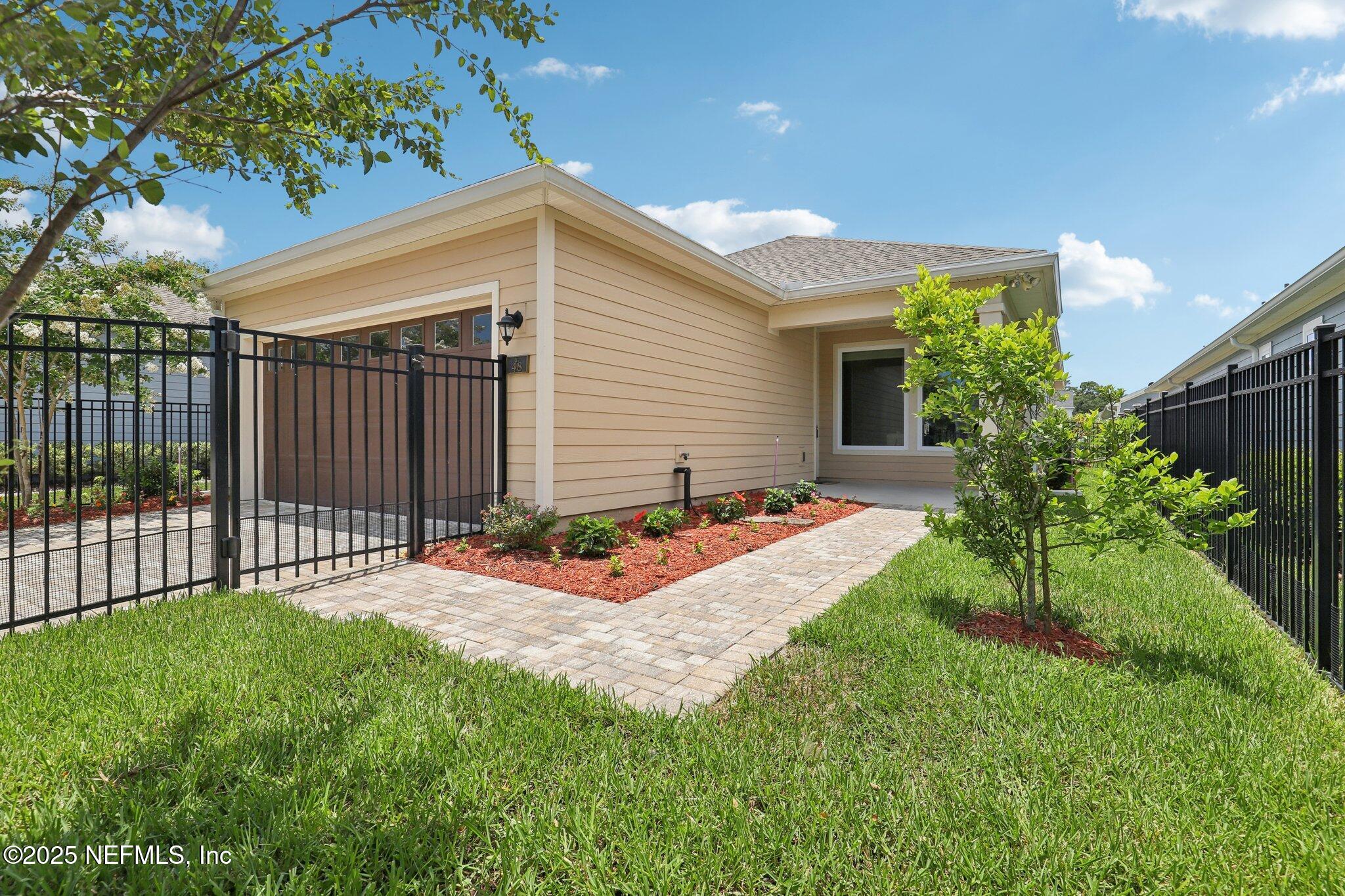 48 Gilchrist Way St. Augustine, FL 32092 - Photo 36 of 50 a view of a backyard with a garden