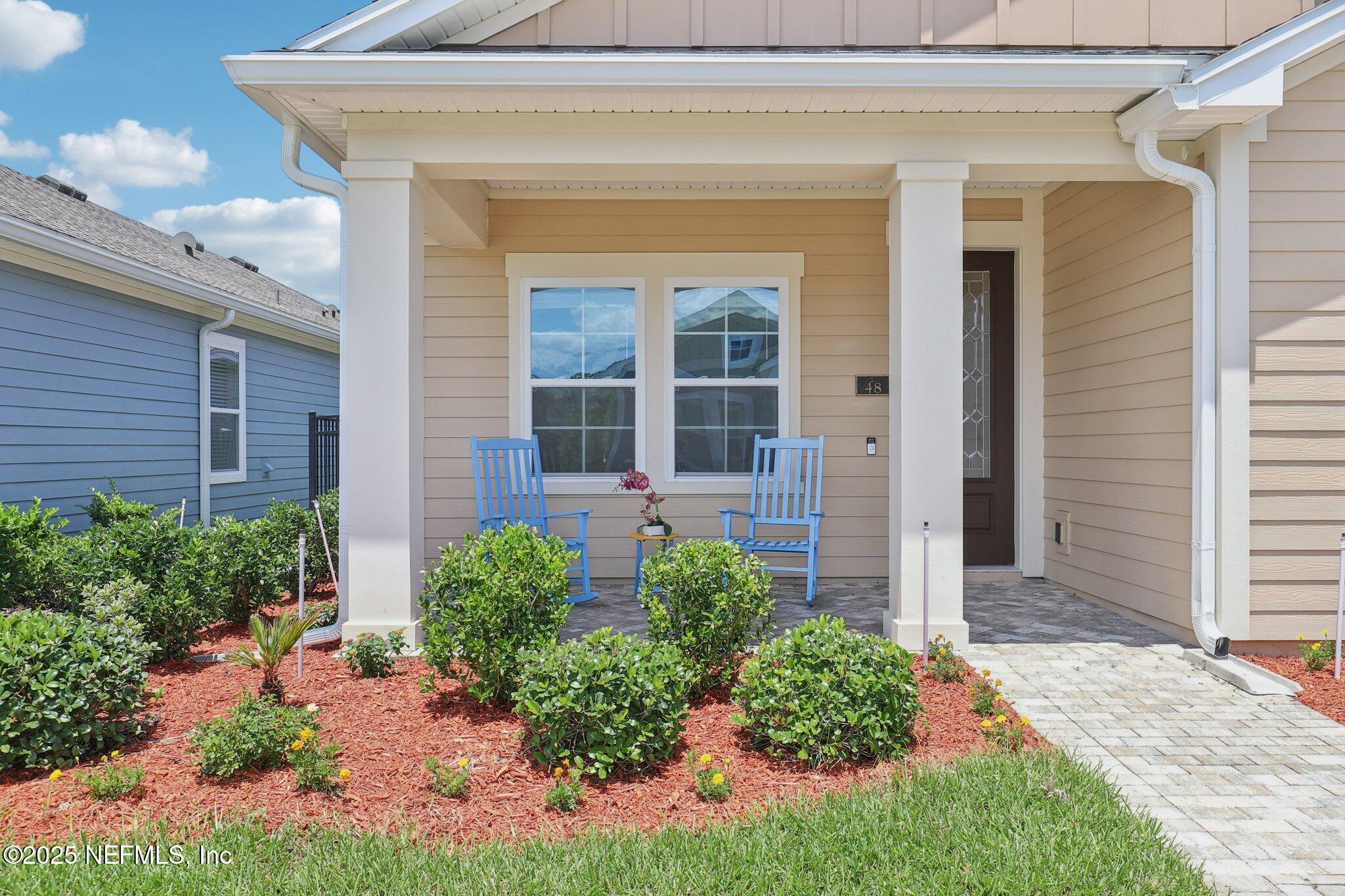 48 Gilchrist Way St. Augustine, FL 32092 - Photo 4 of 50 a front view of a house with garden