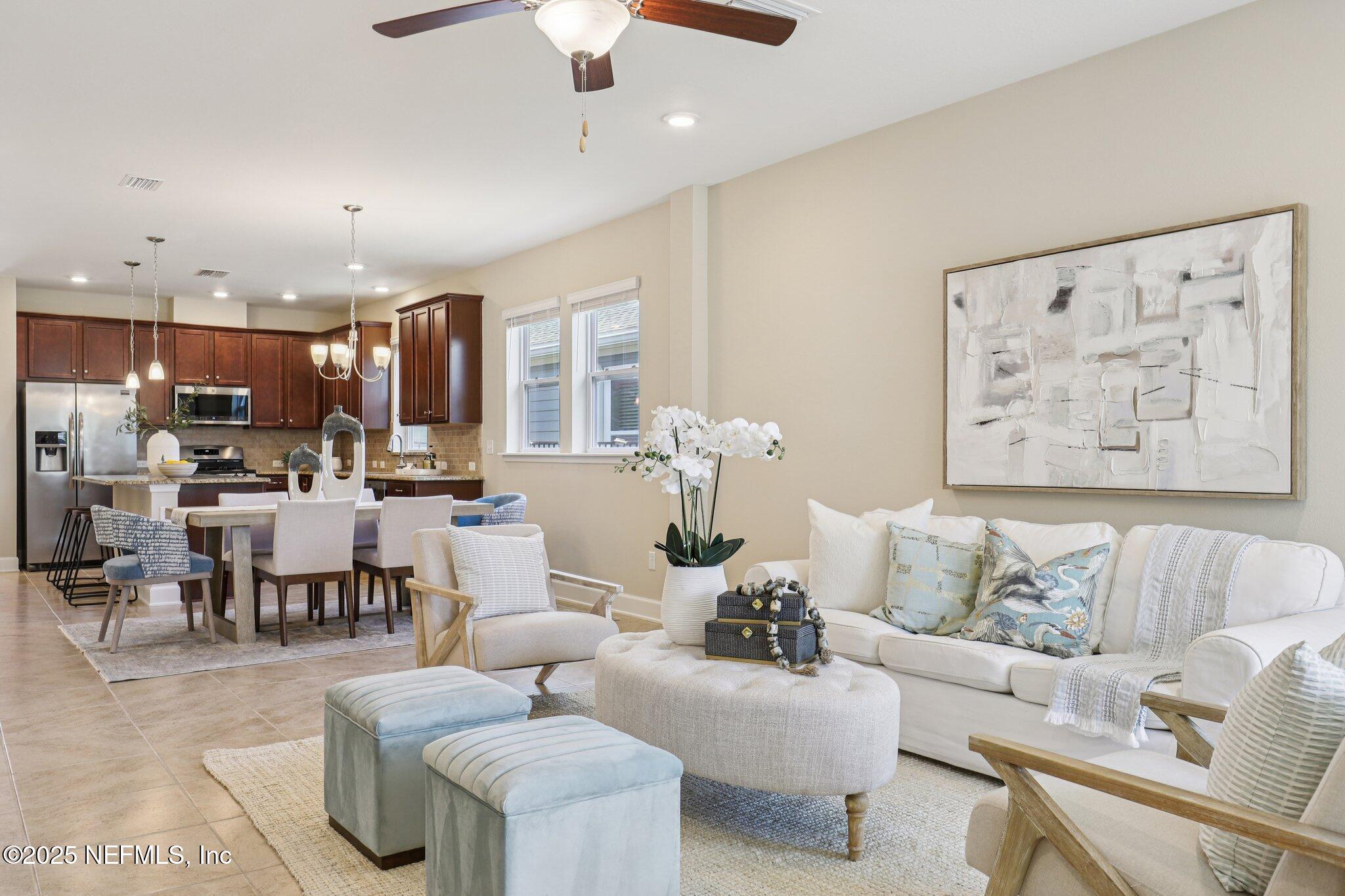 48 Gilchrist Way St. Augustine, FL 32092 - Photo 8 of 50 a living room with furniture and kitchen view