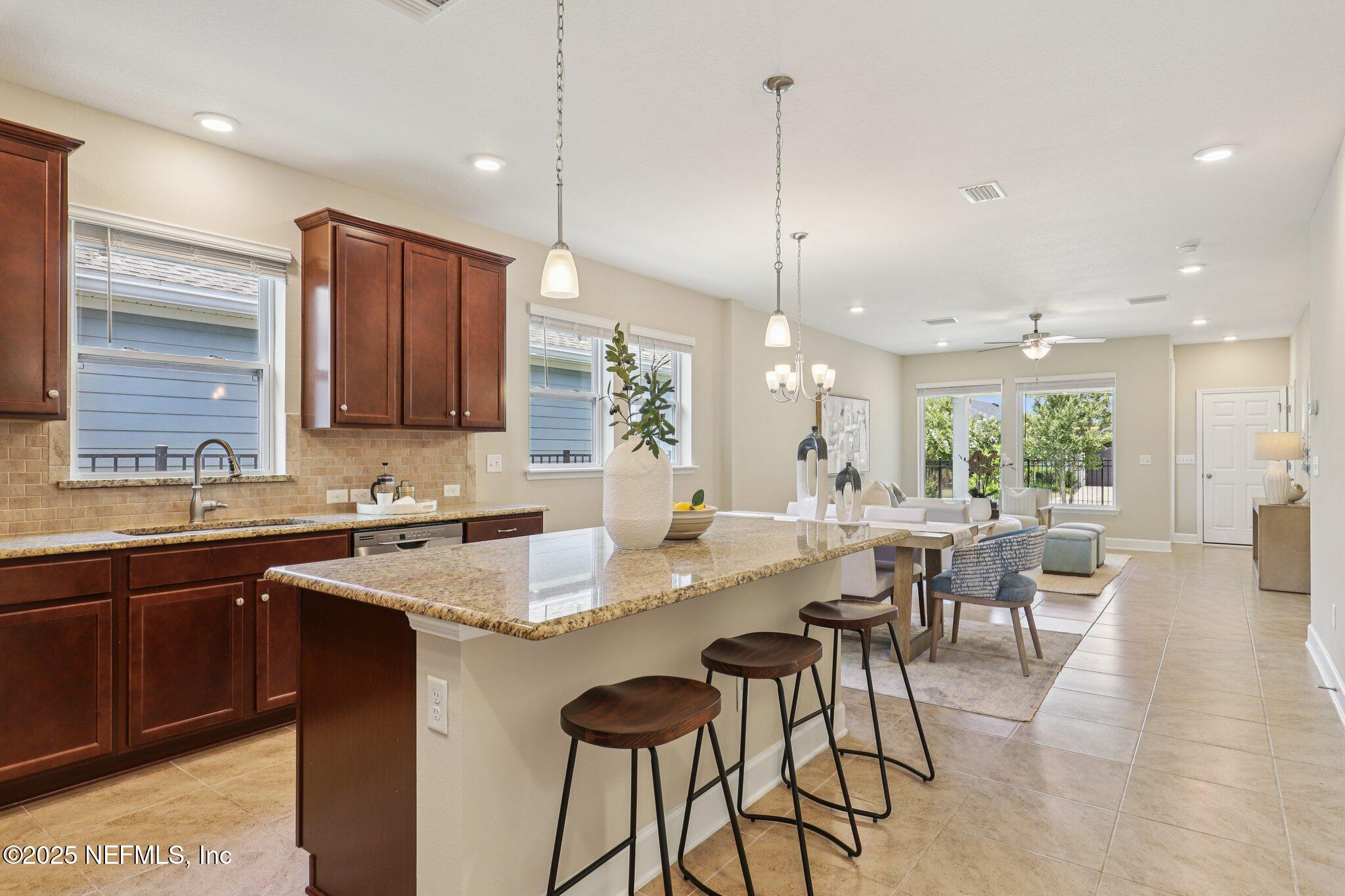 48 Gilchrist Way St. Augustine, FL 32092 - Photo 10 of 50 a large kitchen with a table and chairs