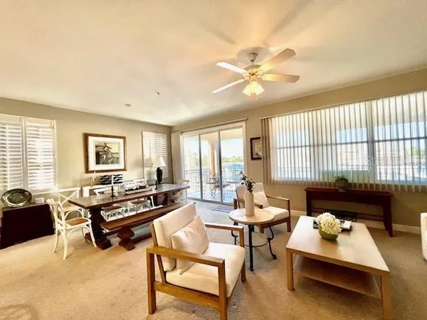 a living room with furniture and a large window