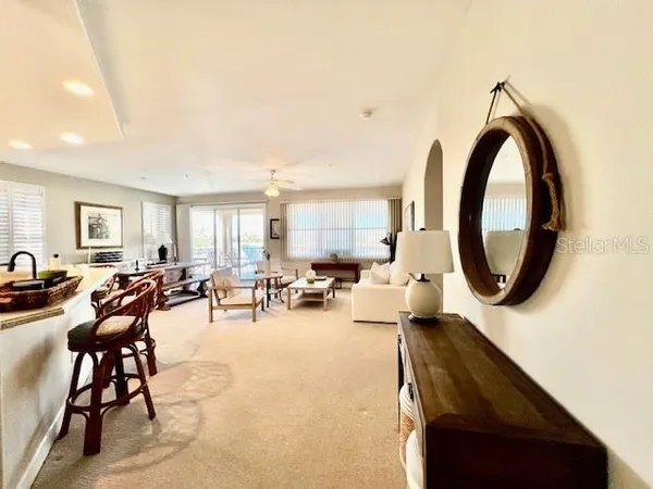 a view of a livingroom with furniture and a window