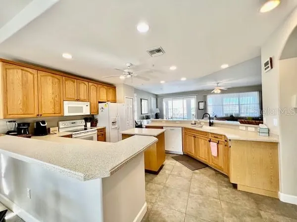 a kitchen with counter top appliances and cabinets