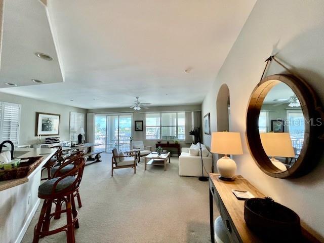 3471 Sunset Key Circle, Unit 102 Punta Gorda, FL 33955 - Photo 13 of 51 a living room with furniture and a large window