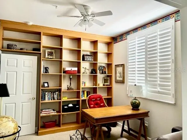 a workspace with furniture and window