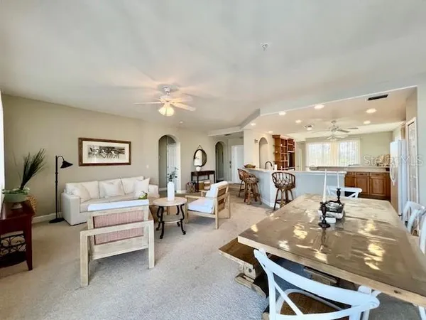 a bedroom with furniture and a flat screen tv