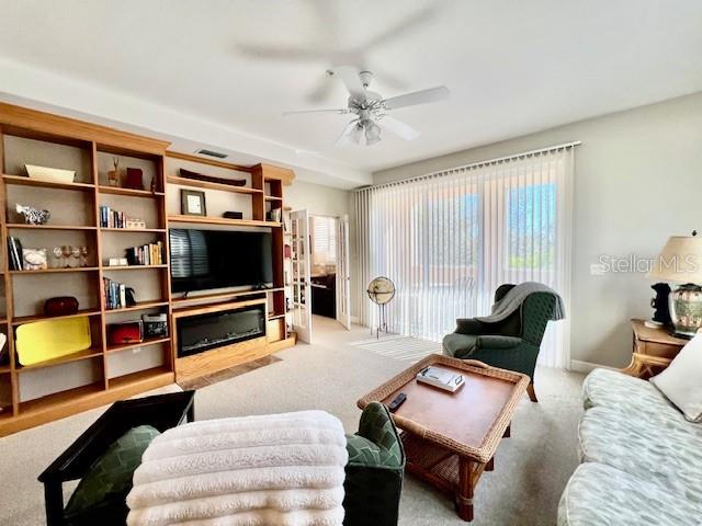 3471 Sunset Key Circle, Unit 102 Punta Gorda, FL 33955 - Photo 21 of 51 a bedroom with furniture and a flat screen tv
