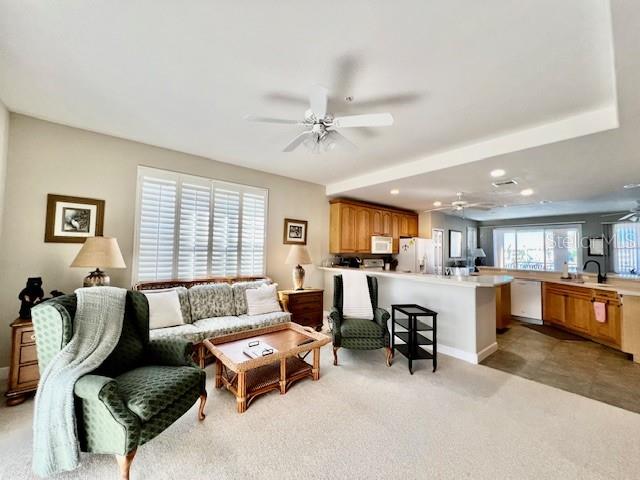 3471 Sunset Key Circle, Unit 102 Punta Gorda, FL 33955 - Photo 22 of 51 a living room with furniture and a window