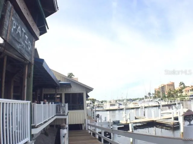 a view of a house with wooden deck and city view