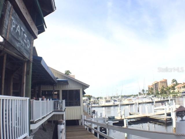 3471 Sunset Key Circle, Unit 102 Punta Gorda, FL 33955 - Photo 34 of 51 a view of a house with wooden deck and city view
