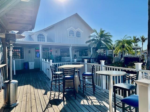 3471 Sunset Key Circle, Unit 102 Punta Gorda, FL 33955 - Photo 47 of 51 a view of a patio with a table and chairs