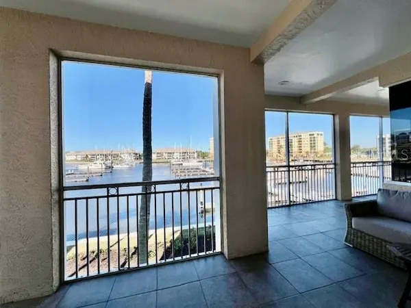 a view of a living room and a balcony