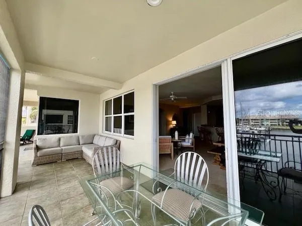 a view of a chairs and table in patio