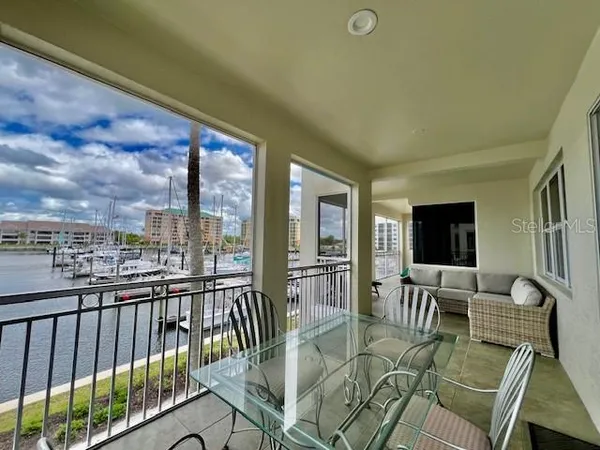 a view of multiple houses with palm trees