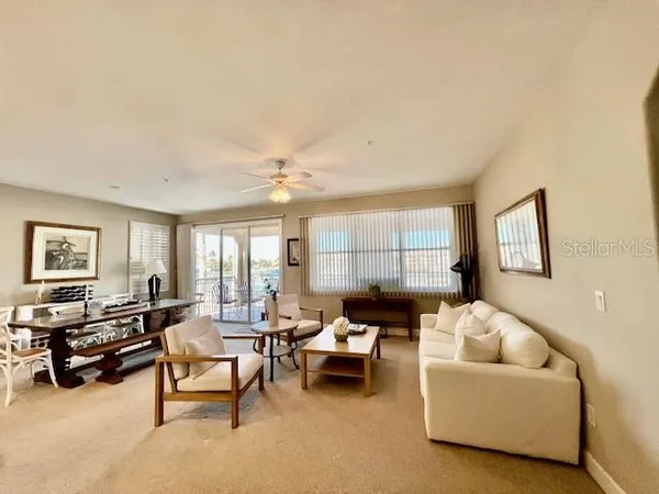 a living room with furniture and a large window