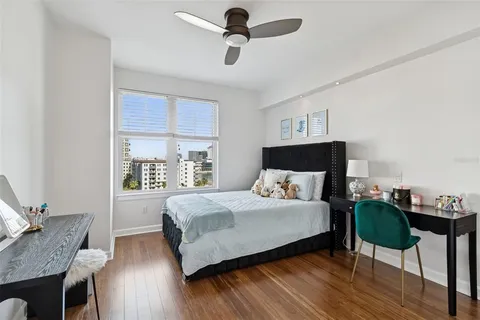 a bathroom with a sink a toilet and a shower curtain