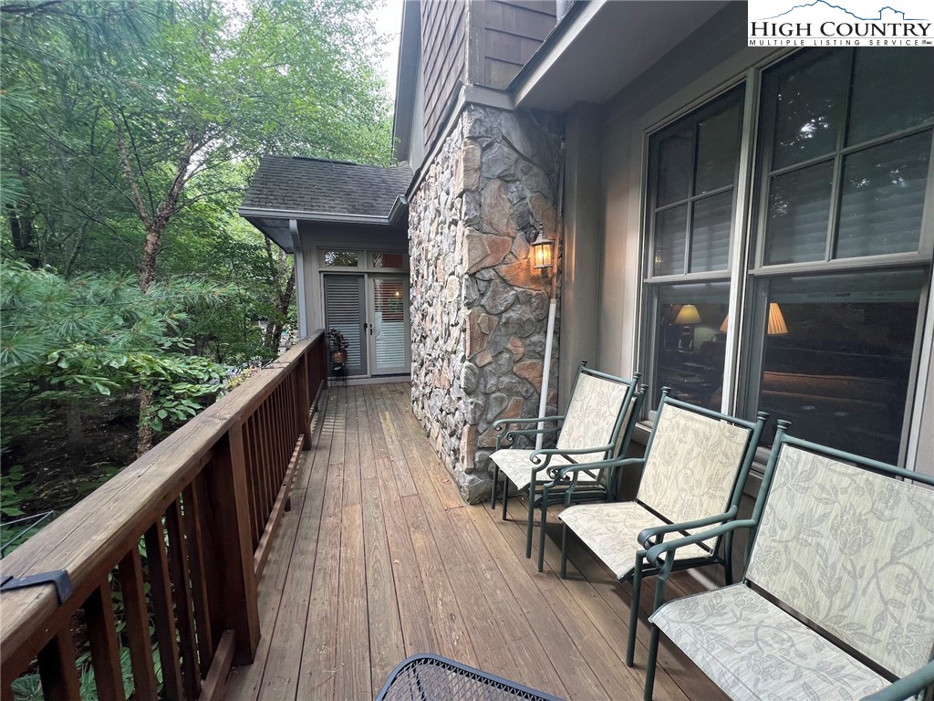 135 Caleb Drive, Unit 4 Blowing Rock, NC 28605 - Photo 17 of 19 a view of balcony with wooden floor and outdoor seating