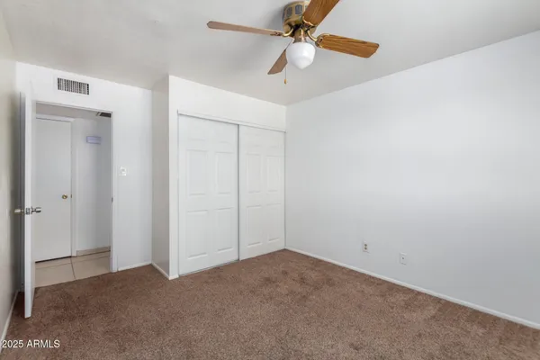 a view of a big room with carpet