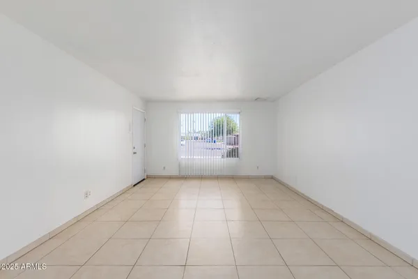 an empty room with white doors