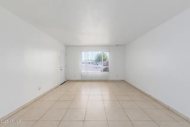 an empty room with white doors