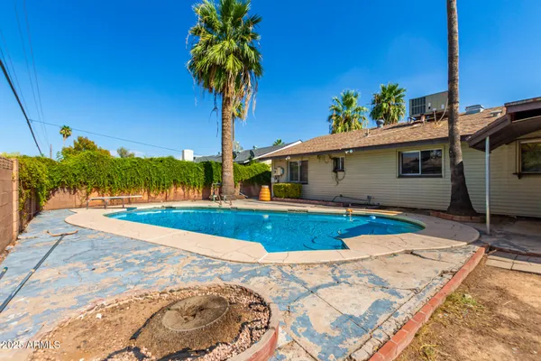 a view of a house with swimming pool