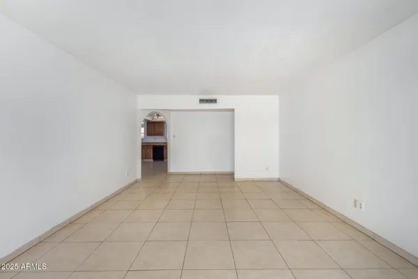 wooden floor in an empty room and a fireplace