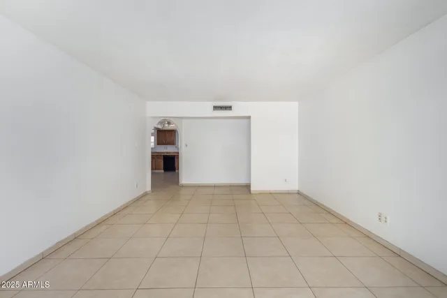 wooden floor in an empty room and a fireplace