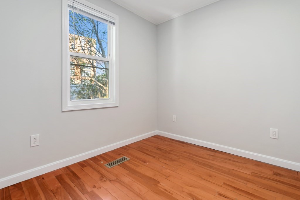 28 Warren Street Peabody, MA 01960 - Photo 15 of 37 wooden floor in an empty room with a window