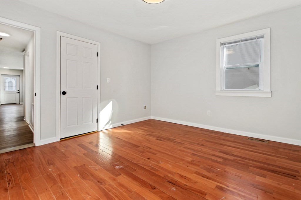 28 Warren Street Peabody, MA 01960 - Photo 19 of 37 a view of empty room with wooden floor and fan